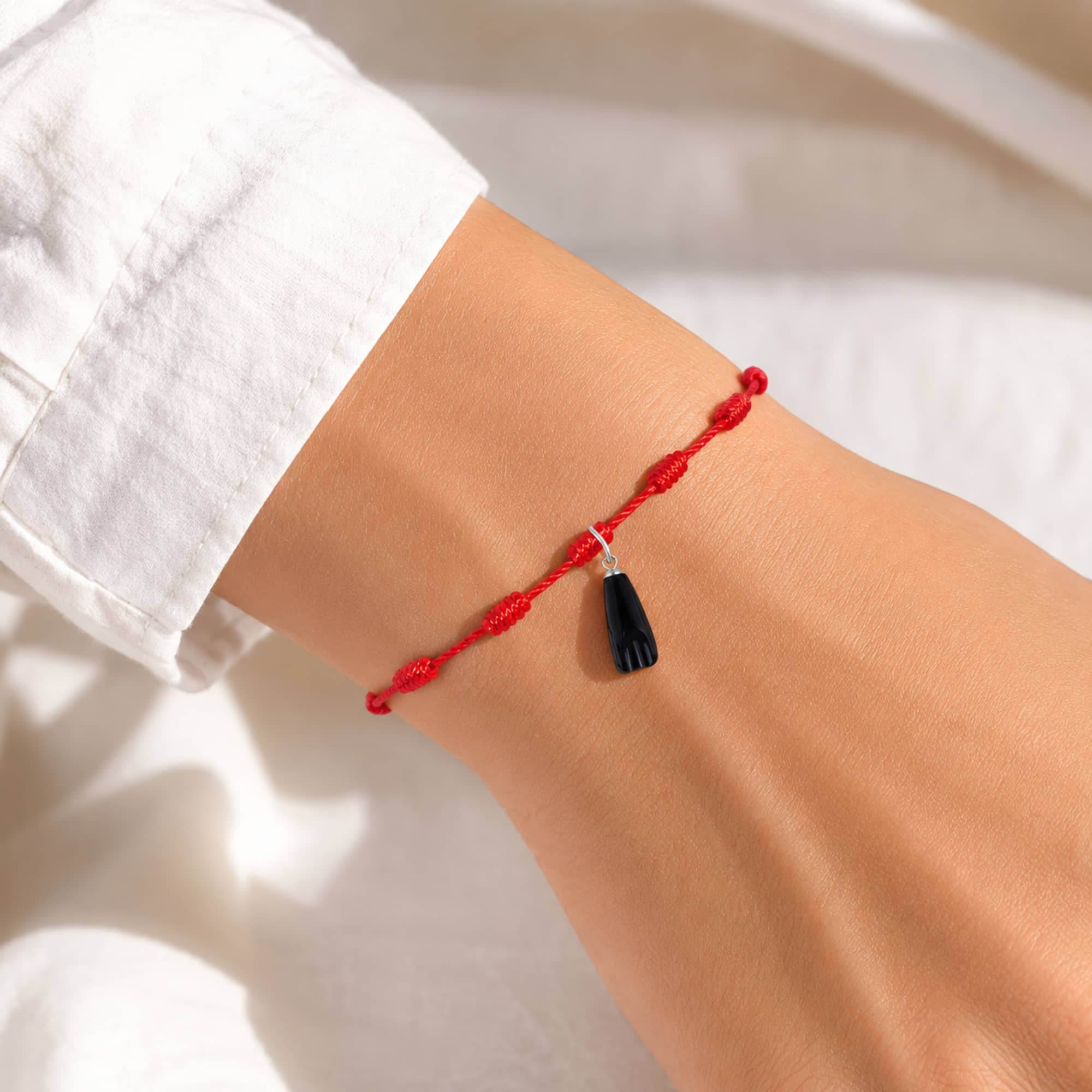 PULSERA 7 NUDOS CON LA HIGA NEGRA