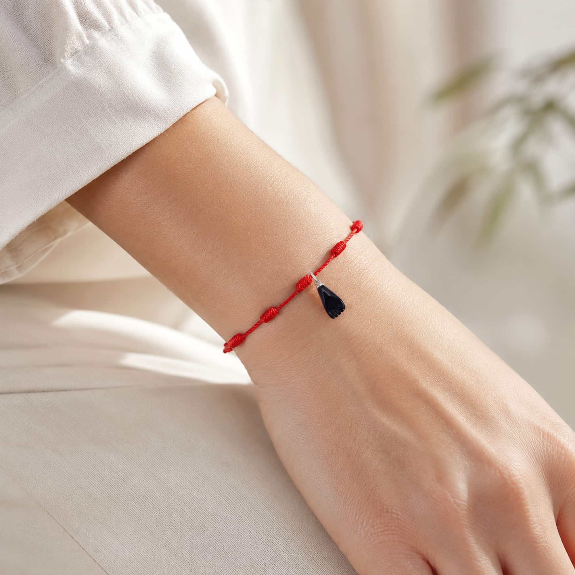 PULSERA 7 NUDOS CON LA HIGA NEGRA