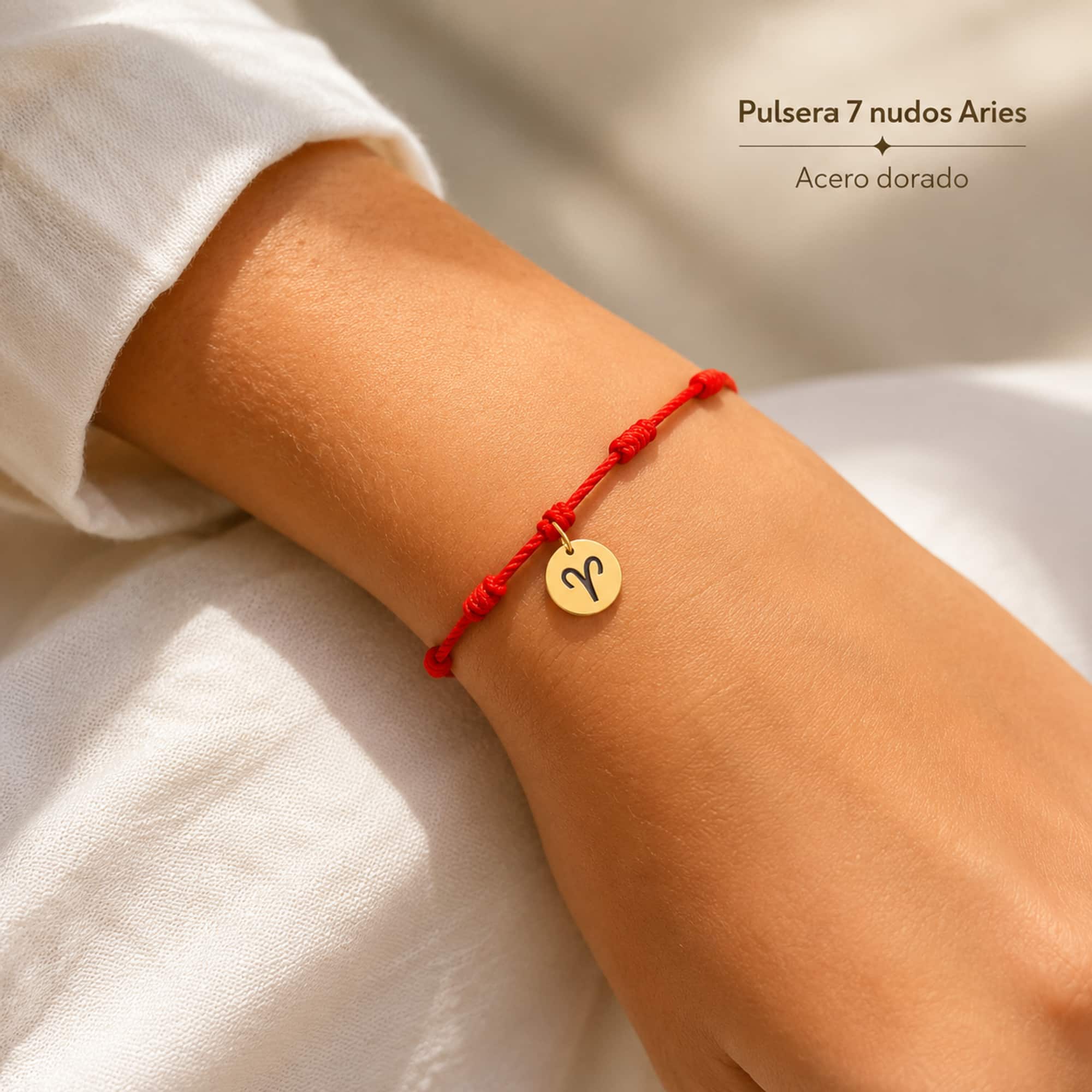 PULSERA 7 NUDOS CON ARIES ACERO. COLOR DORADO