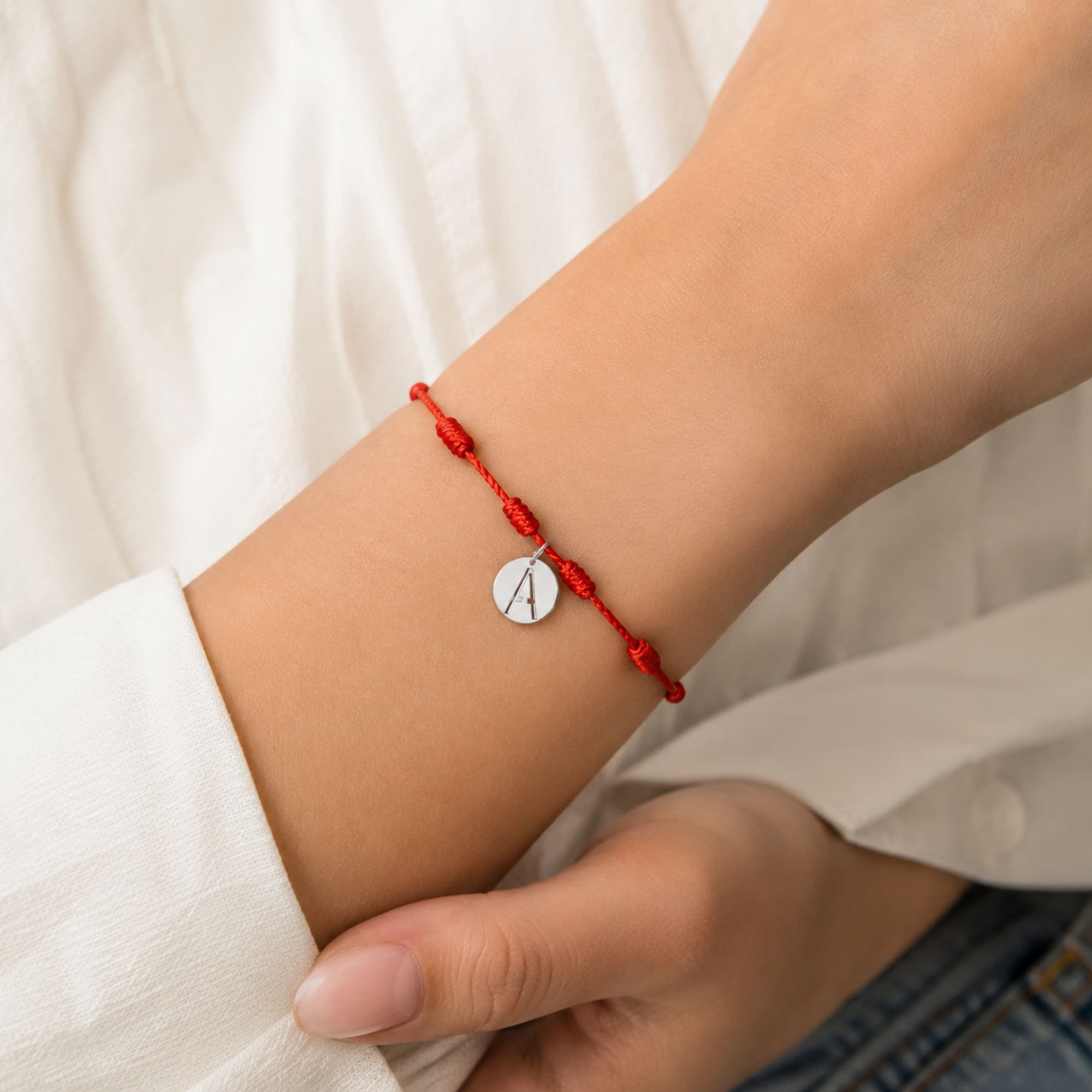 PULSERA 7 NUDOS CON LETRA A COLOR PLATEADO
