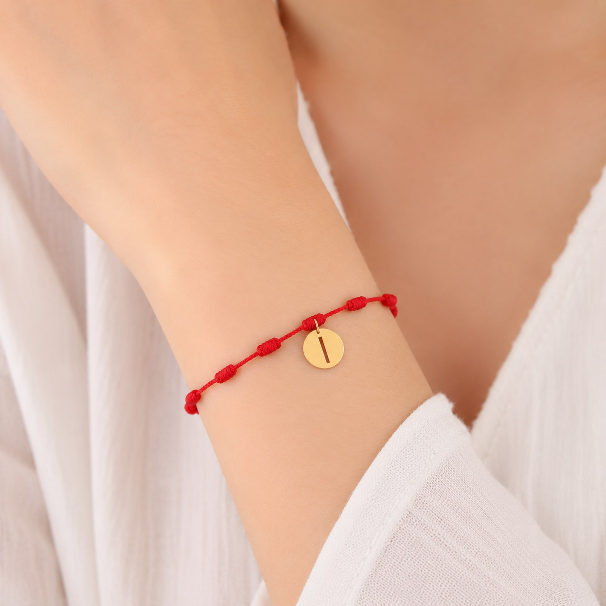 PULSERA 7 NUDOS CON LETRA I COLOR DORADO