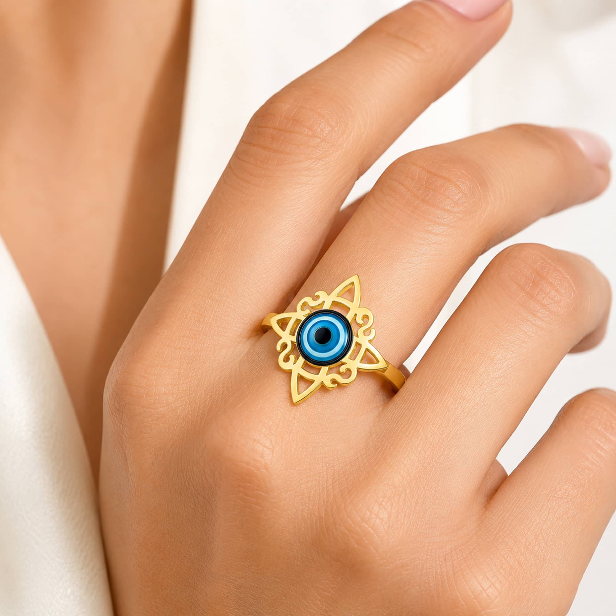 ANILLO NUDO DE BRUJA ACERO DORADO CON OJO DE TURCO