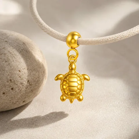 CHARM ACERO DORADO CHAPADO ORO 14 K-CON BOLA DE GOMA