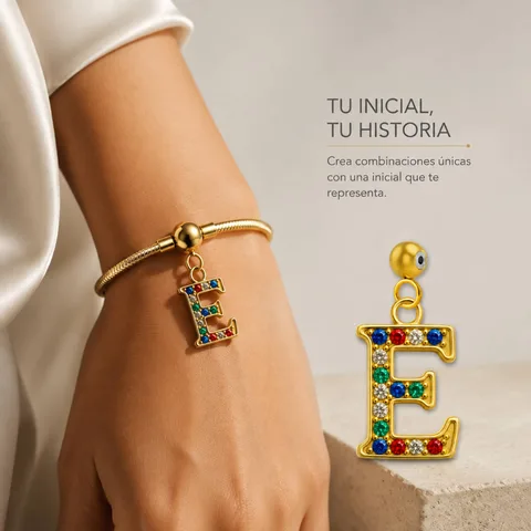 CHARM DE LETRA E ACERO COLOR DORADO CON CIRCONITA-CON BOLA DE GOMA