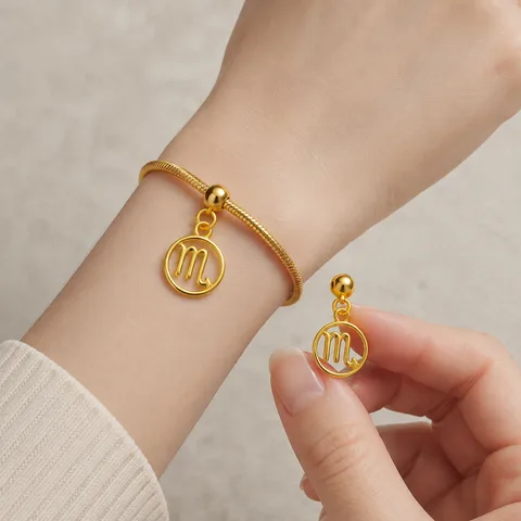 CHARM DE ZODÍACO ESCORPIÃO ACERO COLOR DORADO-CON BOLA DE GOMA