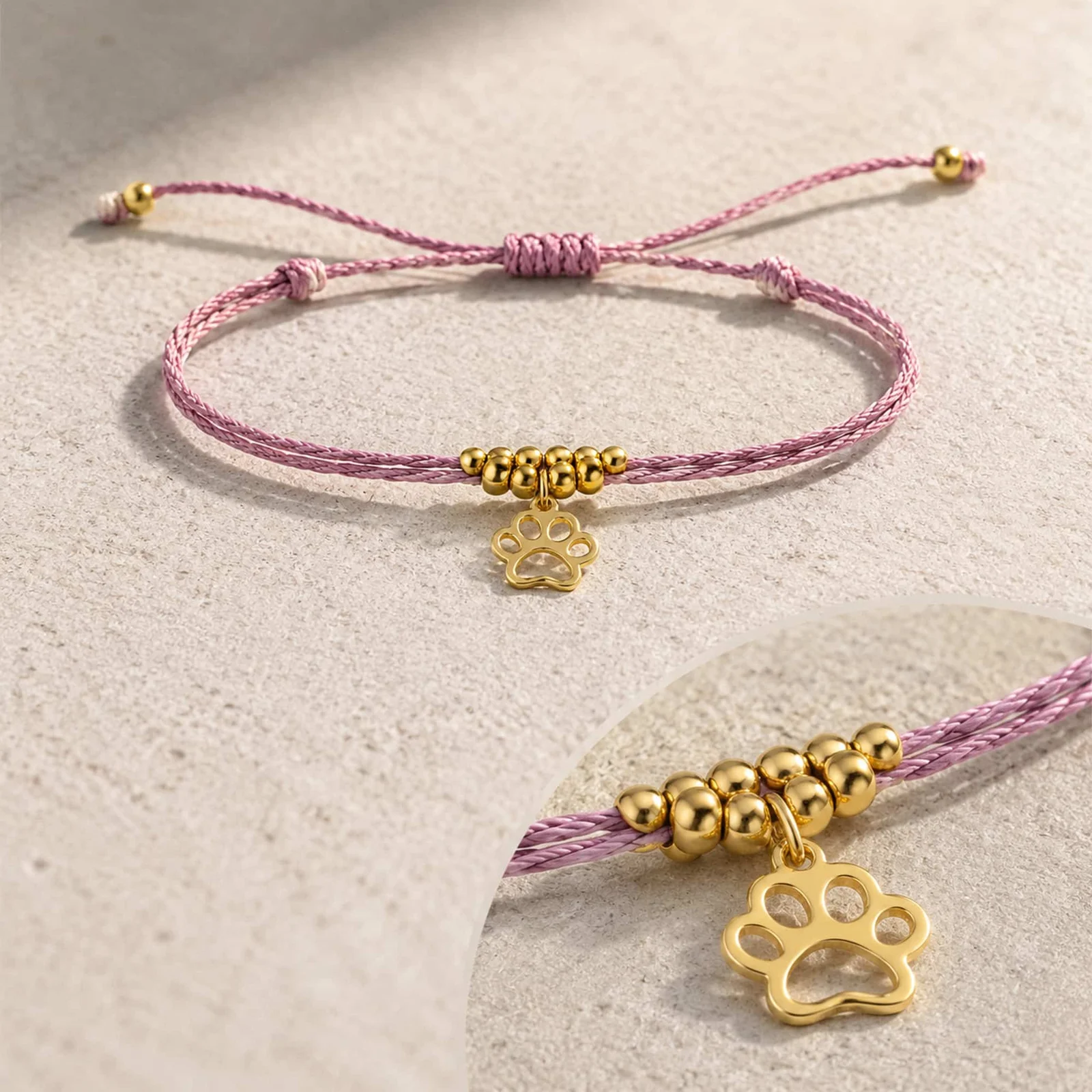 PULSERA HILO ENCERADO CON COLGANTE HUELLA DE GATO ACERO DORADO