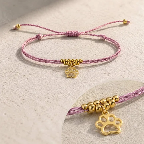 PULSERA HILO ENCERADO CON COLGANTE HUELLA DE GATO ACERO DORADO