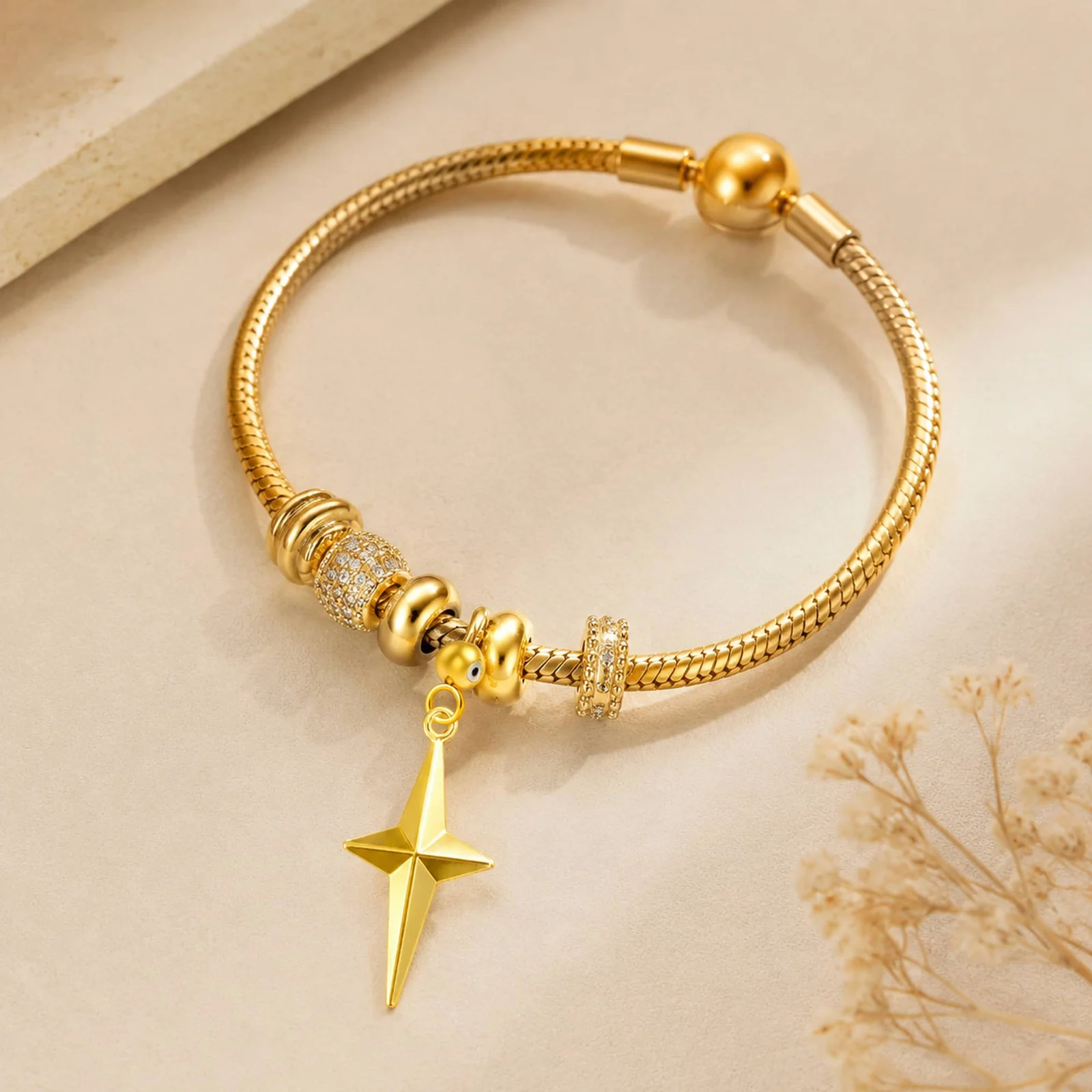 CHARM ACERO DORADO CHAPADO ORO 14 K-CON BOLA DE GOMA
