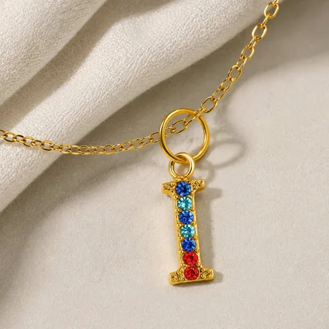 CHARM DE LETRA I ACERO COLOR DORADO CON CIRCONITA