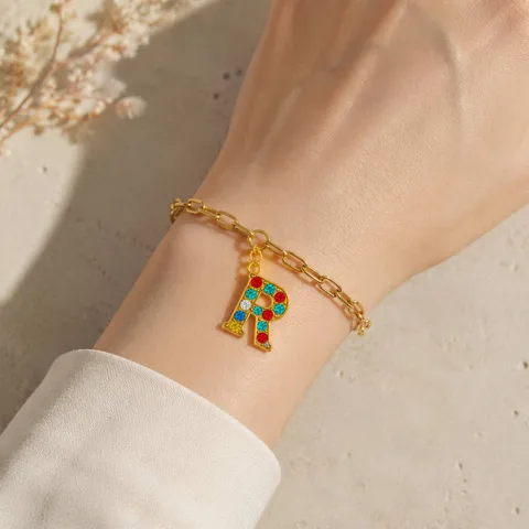 CHARM DE LETRA R ACERO COLOR DORADO CON CIRCONITA-CON CIERRE