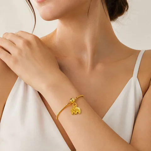 CHARM ACERO DORADO CHAPADO ORO 14 K-CON BOLA DE GOMA