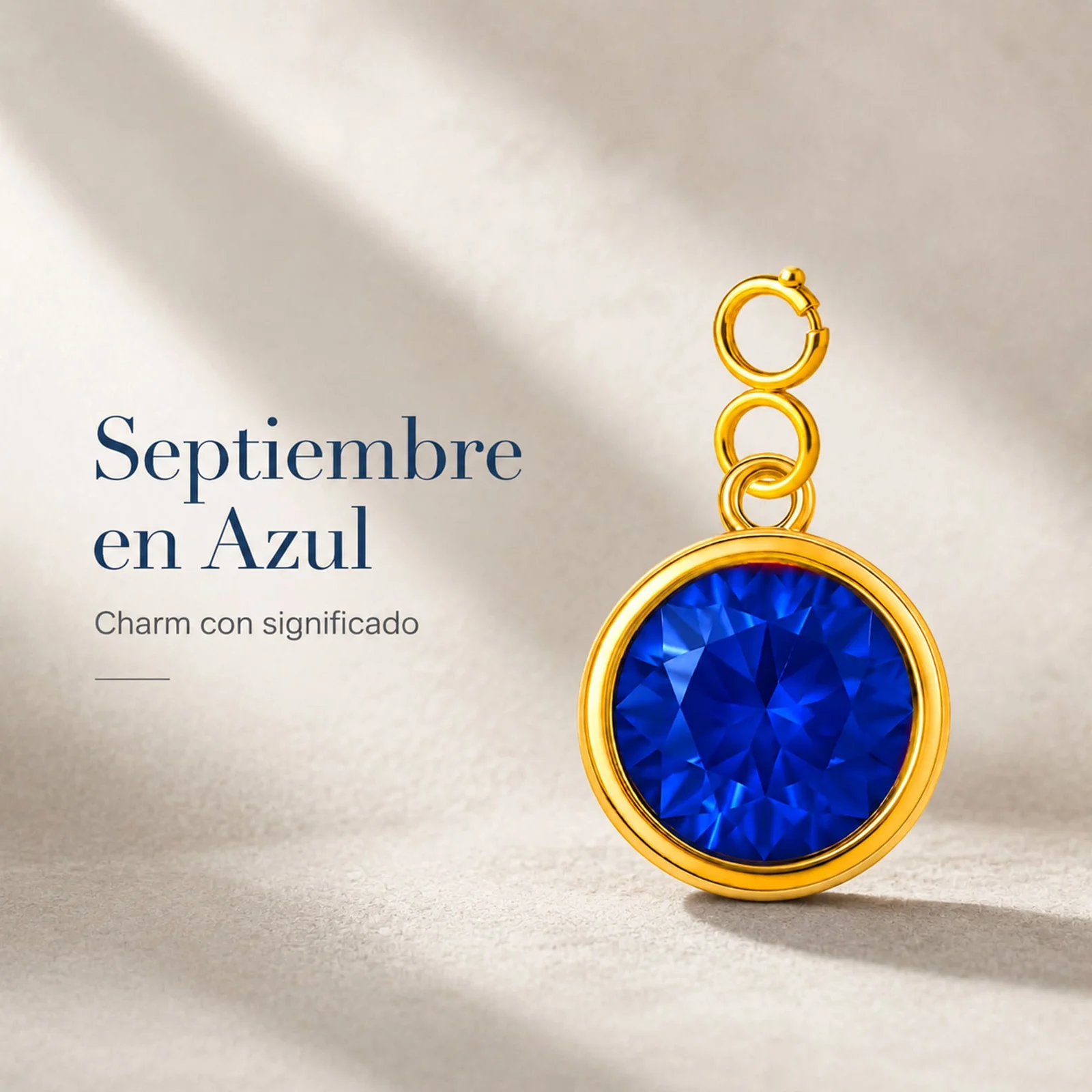 CHARM ACERO DORADO CON PIEDRA NACIMIENTO DE SEPTIEMBRE-CON CIERRE